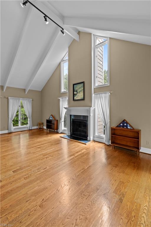 400 Discovery Rd, Virginia Beach, VA 23451 - unfurnished living room featuring track lighting, a fireplace, wood finished floors, and baseboards