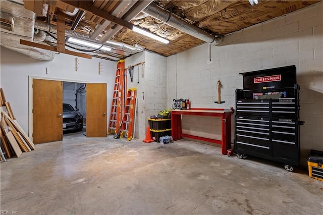400 Discovery Rd, Virginia Beach, VA 23451 - basement featuring a workshop area and concrete block wall