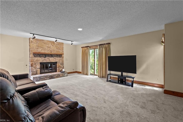 400 Discovery Rd, Virginia Beach, VA 23451 - living area featuring track lighting, baseboards, carpet floors, a textured ceiling, and a fireplace