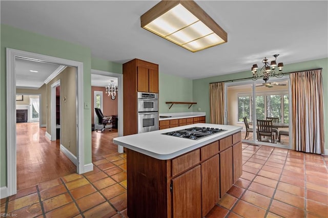 400 Discovery Rd, Virginia Beach, VA 23451 - kitchen featuring a chandelier, appliances with stainless steel finishes, light countertops, a center island, and light tile patterned floors