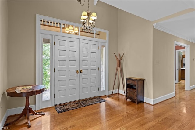 400 Discovery Rd, Virginia Beach, VA 23451 - entryway with a chandelier, light wood-type flooring, baseboards, and crown molding
