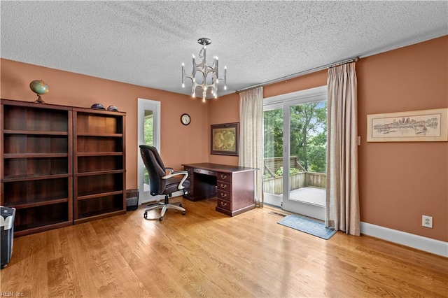 400 Discovery Rd, Virginia Beach, VA 23451 - office featuring plenty of natural light, a textured ceiling, light wood-style flooring, a chandelier, and baseboards