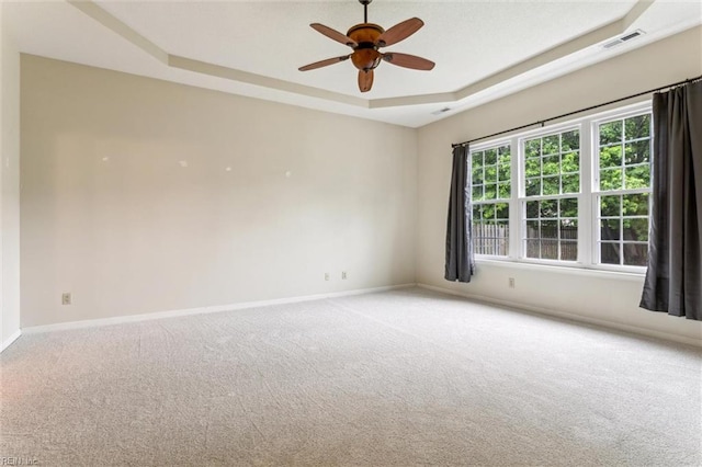 109 Lenora Cv, Smithfield, VA 23430 - empty room featuring a raised ceiling, carpet, a ceiling fan, and baseboards