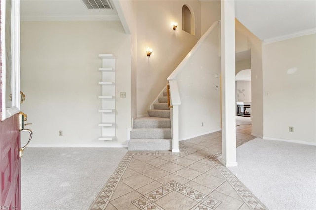 109 Lenora Cv, Smithfield, VA 23430 - carpeted entryway with arched walkways, stairway, ornamental molding, and baseboards