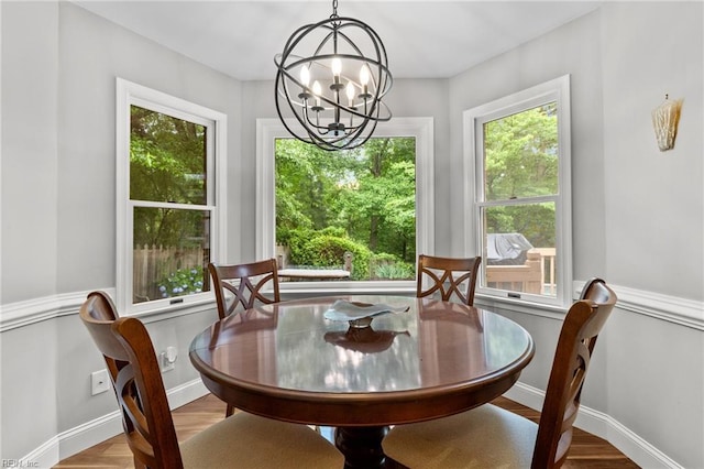3121 Audley Way, Virginia Beach, VA 23452 - dining room featuring a chandelier, wood finished floors, and baseboards