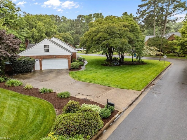 3121 Audley Way, Virginia Beach, VA 23452 - view of property exterior with a yard, brick siding, a garage, and concrete driveway