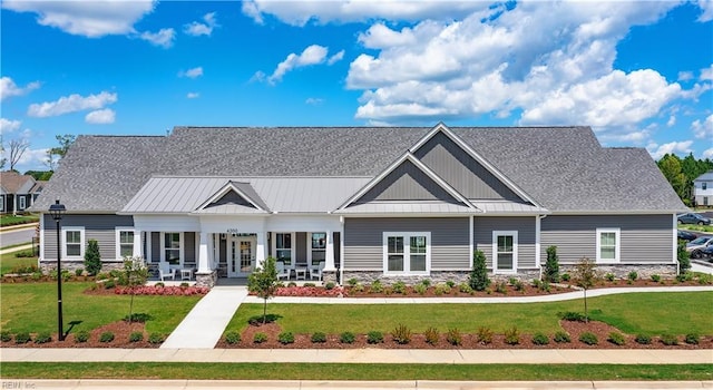 4408 Abercorn Dr, Suffolk, VA 23435 - view of front of home featuring a front yard, stone siding, and covered porch