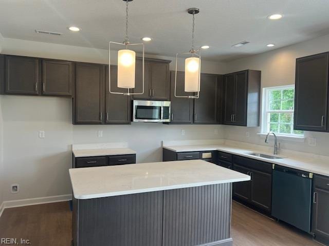 4408 Abercorn Dr, Suffolk, VA 23435 - kitchen featuring dishwasher, stainless steel microwave, a sink, wood finished floors, and recessed lighting