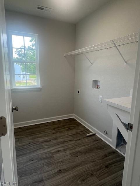 4408 Abercorn Dr, Suffolk, VA 23435 - laundry area with hookup for an electric dryer, hookup for a washing machine, dark wood-type flooring, and baseboards