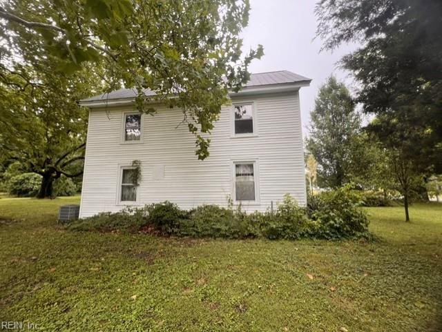 1717 Old Ferry Rd, Hudgins, VA 23076 - view of property exterior featuring a lawn