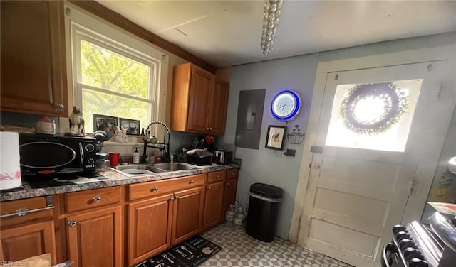1717 Old Ferry Rd, Hudgins, VA 23076 - kitchen featuring a sink, brown cabinetry, and healthy amount of natural light