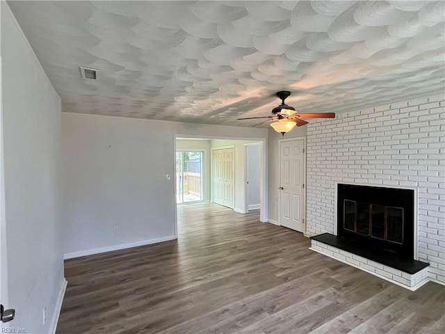 3300 Pine Hill Cres, Chesapeake, VA 23321 - unfurnished living room featuring ceiling fan, wood finished floors, baseboards, and a brick fireplace