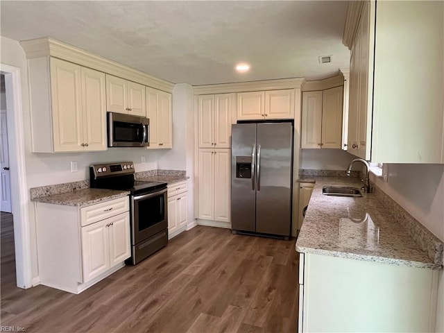 3300 Pine Hill Cres, Chesapeake, VA 23321 - kitchen with stainless steel appliances, a sink, dark wood-type flooring, light stone countertops, and recessed lighting