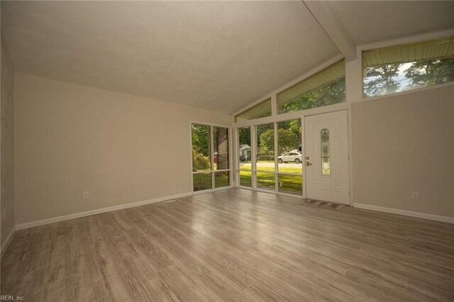 917 Garfield Ave, Suffolk, VA 23434 - spare room with baseboards, wood finished floors, beam ceiling, and high vaulted ceiling