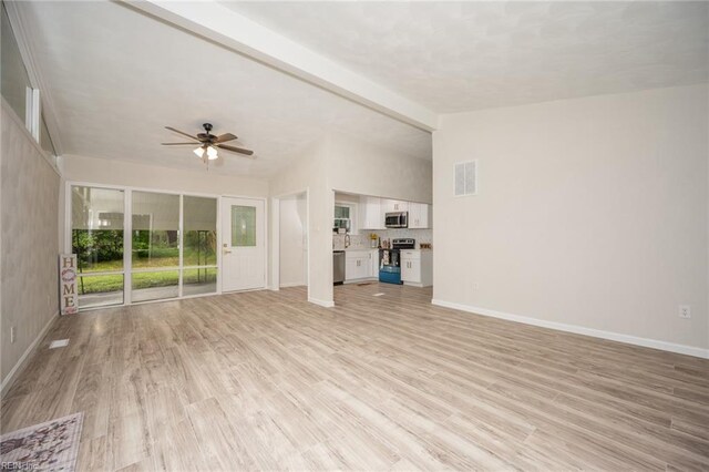 917 Garfield Ave, Suffolk, VA 23434 - unfurnished living room featuring light wood-style flooring, ceiling fan, and baseboards