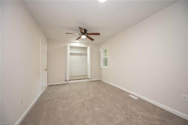 917 Garfield Ave, Suffolk, VA 23434 - unfurnished bedroom with baseboards, carpet floors, a closet, and ceiling fan