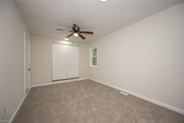 917 Garfield Ave, Suffolk, VA 23434 - unfurnished bedroom with baseboards, a closet, carpet floors, and a ceiling fan