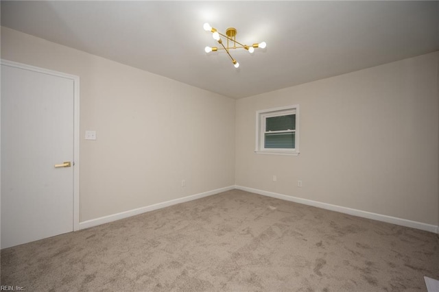 917 Garfield Ave, Suffolk, VA 23434 - carpeted empty room with a chandelier and baseboards