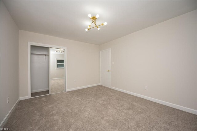 917 Garfield Ave, Suffolk, VA 23434 - unfurnished bedroom featuring a chandelier, carpet flooring, and baseboards