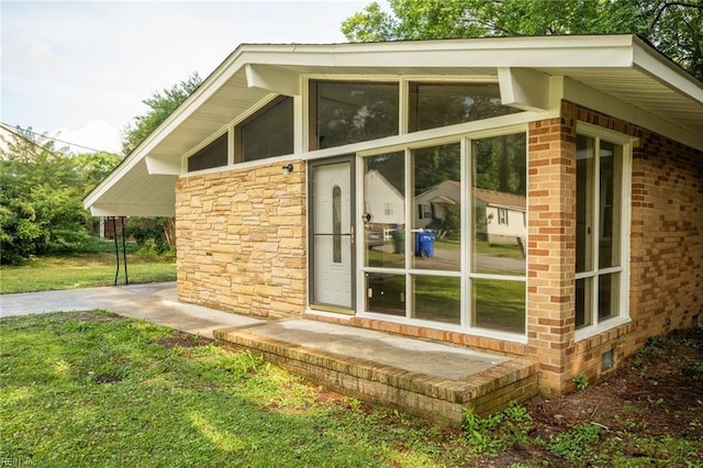 917 Garfield Ave, Suffolk, VA 23434 - view of property exterior featuring stone siding, brick siding, and a yard