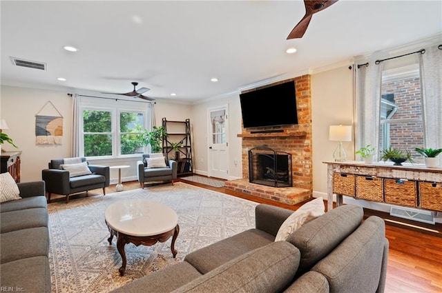 4252 Country Club Cir, Virginia Beach, VA 23455 - living area featuring a ceiling fan, wood finished floors, recessed lighting, ornamental molding, and a brick fireplace
