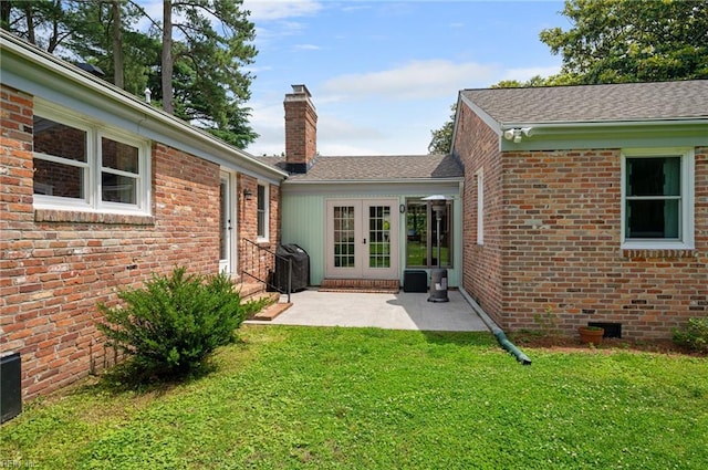4252 Country Club Cir, Virginia Beach, VA 23455 - rear view of house with french doors, a chimney, a lawn, and brick siding