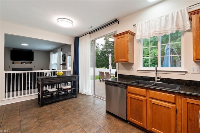 302 Peachwood Ct, Suffolk, VA 23434 - kitchen featuring stainless steel dishwasher, a sink, plenty of natural light, and brown cabinetry