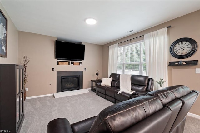 302 Peachwood Ct, Suffolk, VA 23434 - living room featuring carpet, baseboards, and a glass covered fireplace