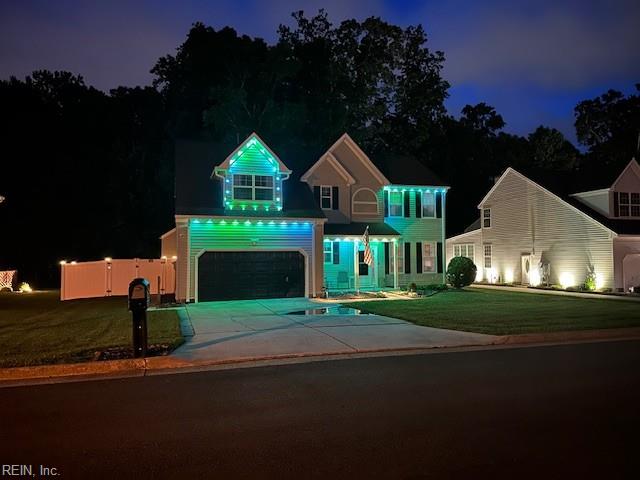 302 Peachwood Ct, Suffolk, VA 23434 - view of front facade with concrete driveway, a lawn, and a garage