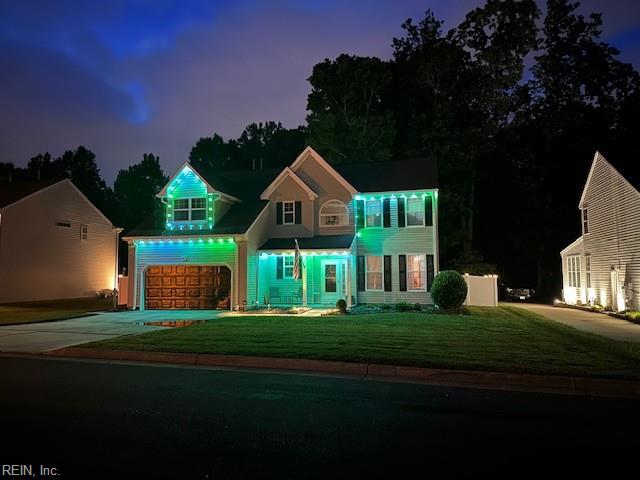 302 Peachwood Ct, Suffolk, VA 23434 - view of front of home featuring driveway, a garage, and a front lawn