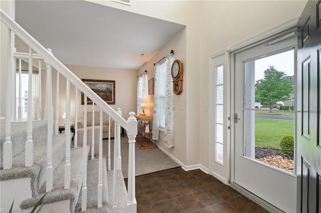 302 Peachwood Ct, Suffolk, VA 23434 - entryway featuring stairs, plenty of natural light, and dark tile patterned floors