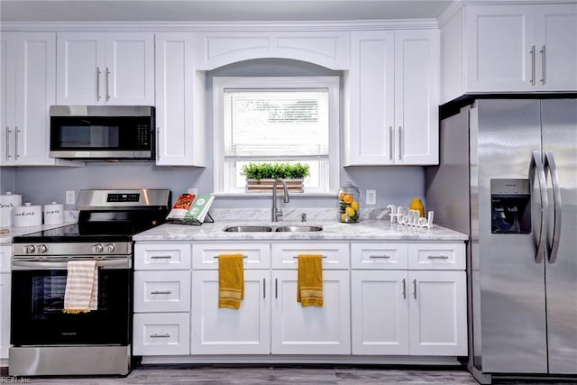 319 Greenbriar Ave, Hampton, VA 23661 - kitchen with appliances with stainless steel finishes, a sink, and white cabinets