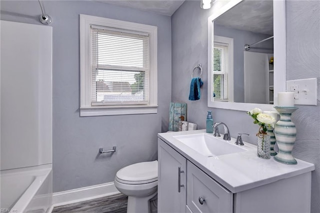 319 Greenbriar Ave, Hampton, VA 23661 - bathroom with baseboards, vanity, wood finished floors, toilet, and shower / bath combination