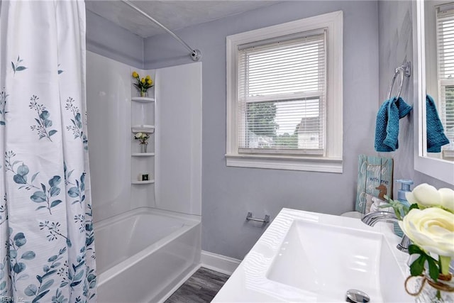 319 Greenbriar Ave, Hampton, VA 23661 - bathroom with shower / tub combo, baseboards, vanity, and wood finished floors