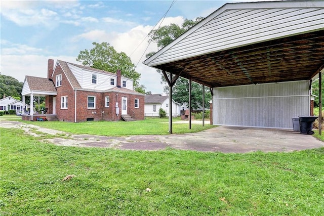 319 Greenbriar Ave, Hampton, VA 23661 - view of property exterior featuring brick siding, concrete driveway, a yard, and entry steps