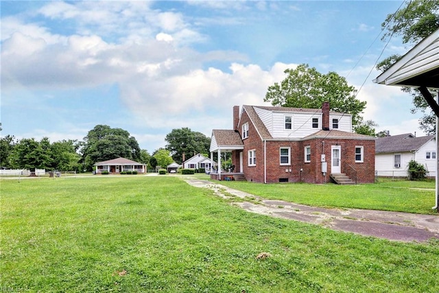319 Greenbriar Ave, Hampton, VA 23661 - view of property exterior with brick siding, a chimney, entry steps, and a lawn