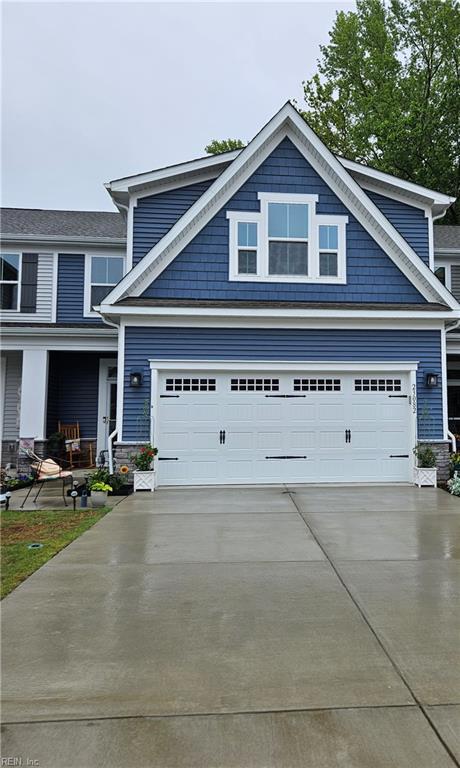 23082 Retreat Ln, Carrollton, VA 23314 - view of front of home with concrete driveway and a porch