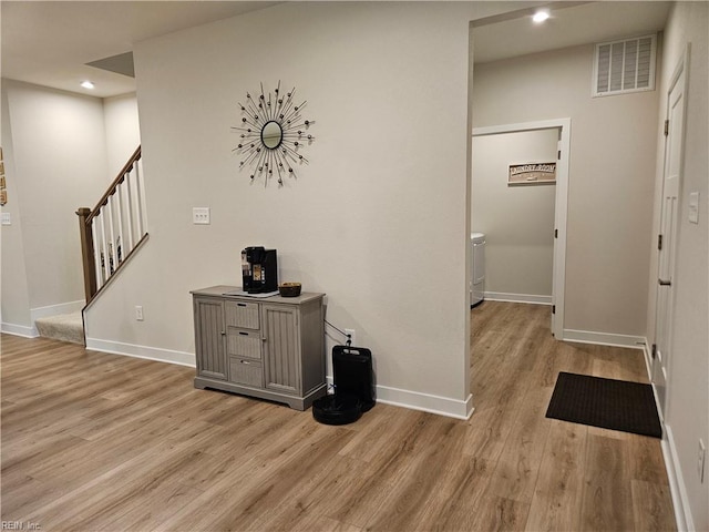 23082 Retreat Ln, Carrollton, VA 23314 - hallway featuring light wood-type flooring, stairs, recessed lighting, and baseboards