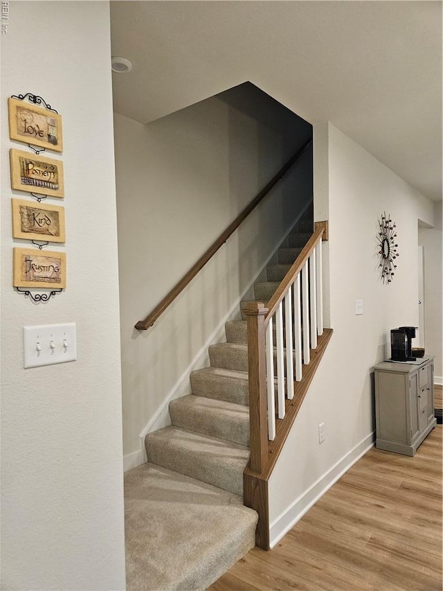 23082 Retreat Ln, Carrollton, VA 23314 - stairs with baseboards and wood finished floors