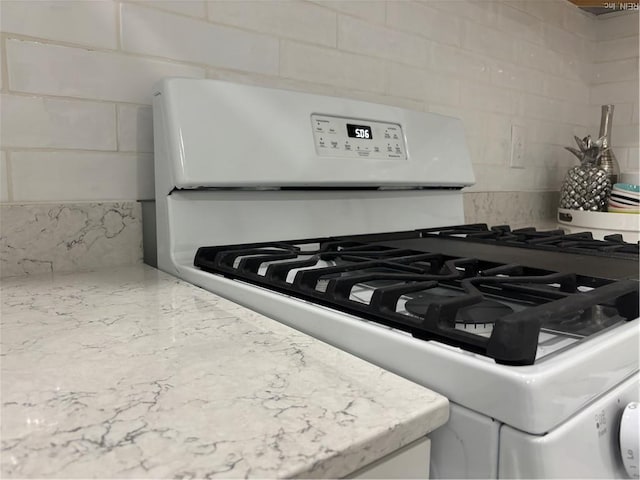432 Maryle Ct, Newport News, VA 23602 - kitchen view of white gas range, backsplash, and light stone counters