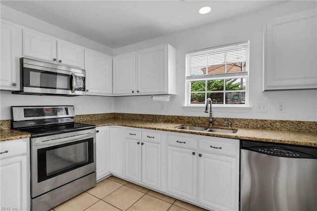 3005 Beech Grove Ln, Suffolk, VA 23435 - kitchen featuring stainless steel appliances, a sink, white cabinets, light tile patterned flooring, and recessed lighting