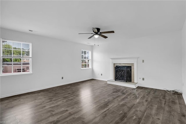 3005 Beech Grove Ln, Suffolk, VA 23435 - unfurnished living room with plenty of natural light, dark wood-style floors, a ceiling fan, and a premium fireplace