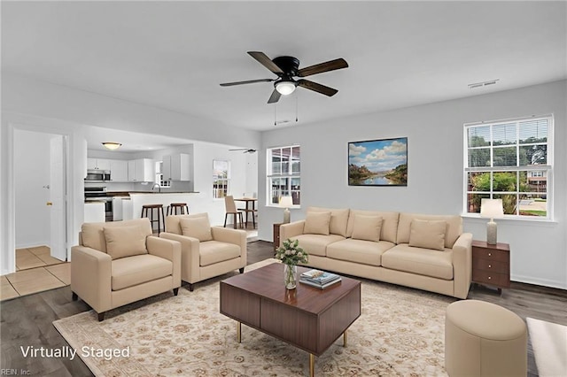 3005 Beech Grove Ln, Suffolk, VA 23435 - living room with a ceiling fan, wood finished floors, and baseboards