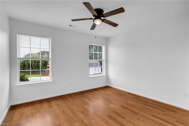 3005 Beech Grove Ln, Suffolk, VA 23435 - empty room with baseboards, wood finished floors, and a ceiling fan