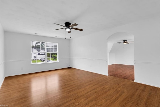 3005 Beech Grove Ln, Suffolk, VA 23435 - unfurnished room with ceiling fan, wood finished floors, baseboards, and arched walkways