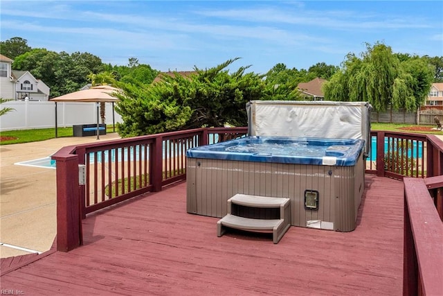 3005 Beech Grove Ln, Suffolk, VA 23435 - wooden terrace featuring a hot tub, a fenced backyard, view of scattered trees, and a pool