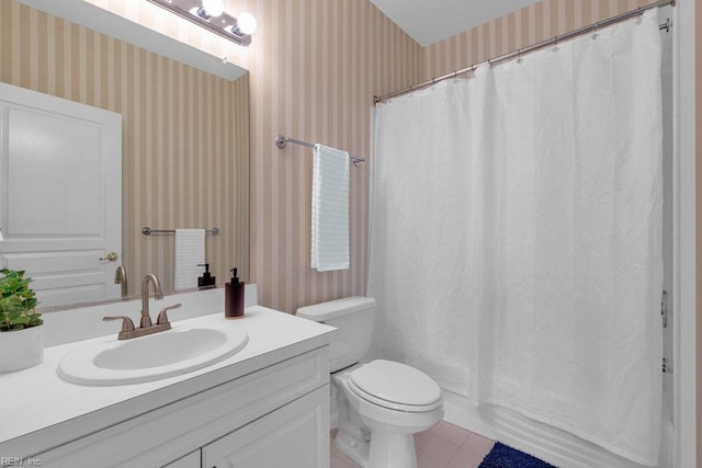 301 Brooke Ave Unit 103, Norfolk, VA 23510 - bathroom with wallpapered walls, vanity, toilet, tile patterned floors, and shower / bath combo