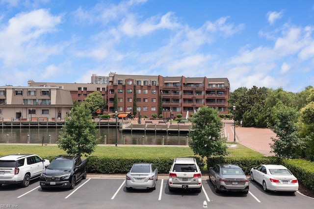 301 Brooke Ave Unit 103, Norfolk, VA 23510 - view of property with uncovered parking and a water view