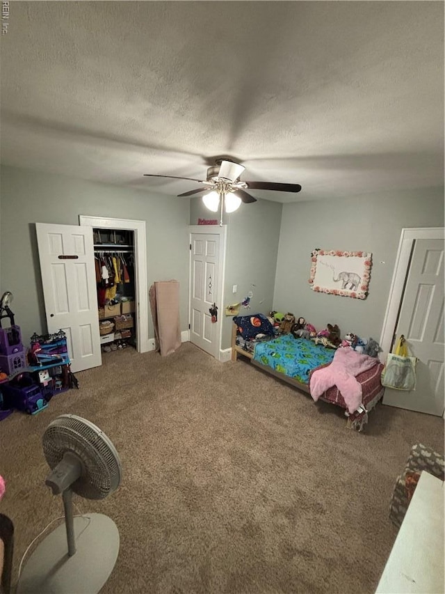 709 Smith St, Suffolk, VA 23434 - carpeted bedroom featuring a textured ceiling, a ceiling fan, and a closet