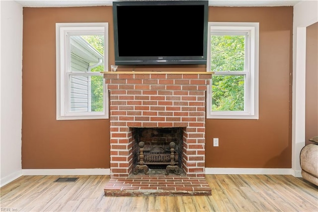 891 Bells Mill Rd, Chesapeake, VA 23322 - detailed view of wood finished floors, baseboards, and a brick fireplace